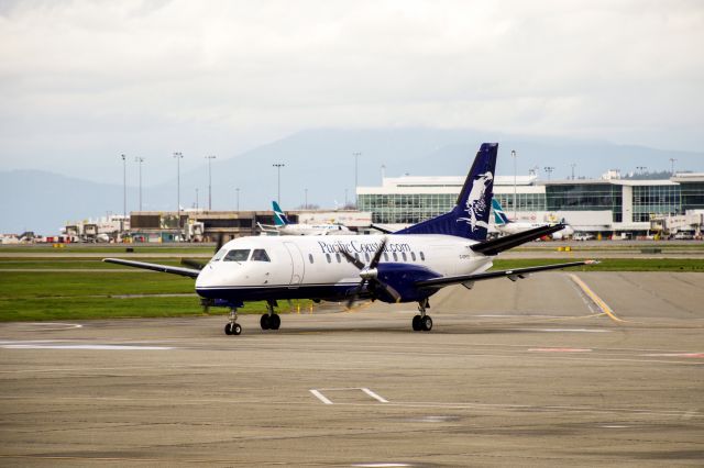 Saab 340 (C-GPCQ) - Taxying in to YVRs south terminal. Shot from the viewing platform.