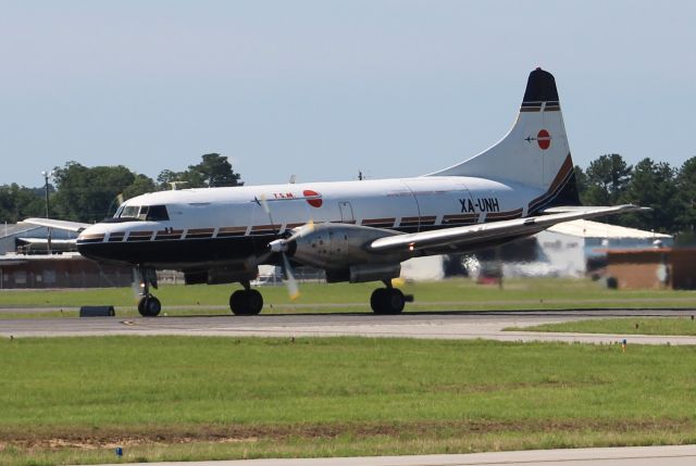 CONVAIR CV-580 (XA-UNH) - A Convair CV-640 on its takeoff run down Runway 22 at Tuscaloosa Regional Airport, AL - June 17, 2017.