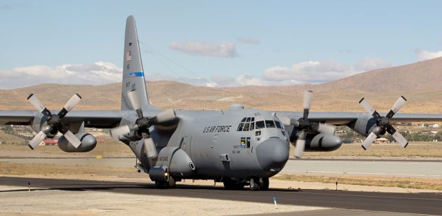 Lockheed C-130 Hercules (79-0477) - Using just the two inboards, a Nevada Air Guard High Rollers Hercules (79-0477, Roller Seven Seven) taxies toward Reno Stead Airports runway 26. 