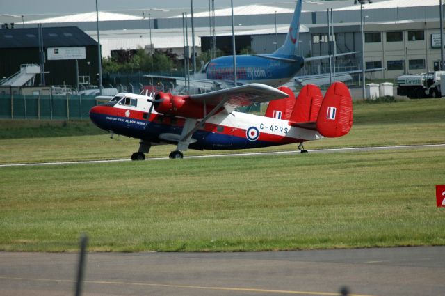 SCOTTISH AVIATION Twin Pioneer (G-APRS) - Aviation Heritage - Scottish Aviation Twin Pioneer (G-APRS) taxiing for take off at Coventry Airport with ThomsonFly B737--5L9 (G-THOB) on stand in the background (Photo Jun 2005)