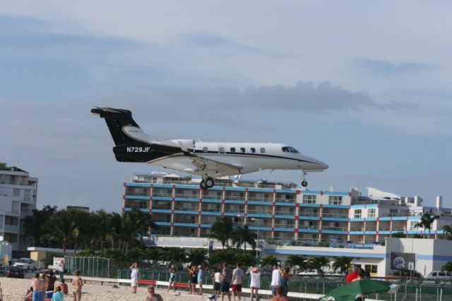 Embraer Phenom 300 (N729JF) - Crossing the fence at St. Maarten