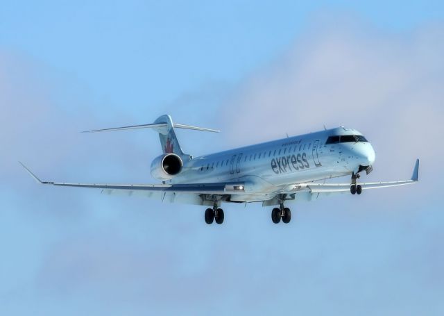 Canadair Regional Jet CRJ-900 (C-FNJZ) - Arriving from a flight from Winnipeg on 27-Dec-13.