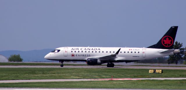 Embraer ERJ 175 (C-FEJY) - Taxiing to parking is this 2005 Air Canada Express Embraer 175SU in the Spring of 2024.