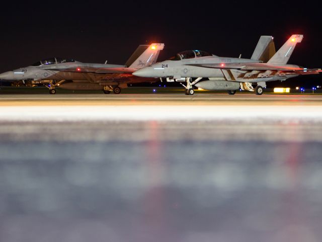 McDonnell Douglas FA-18 Hornet (16-6640) - Two F/A-18F Super Hornets from VFA-213 Blacklions (AJ-213 and AJ-214)prepare for a night takeoff after a fuel stop enroute to NAS Oceana in Green Bay, WI.  