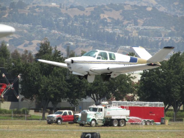Beechcraft 35 Bonanza (N1966D) - Taking off RWY 26L