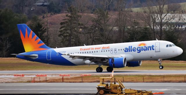 Airbus A320 (N217NV) - An Allegiant A320 arriving from PIE into AVL's mountain milieu. A great way to round out the first spotting day of the year, which was also New Year's Day! From the parking deck of AVL, 1/1/19.