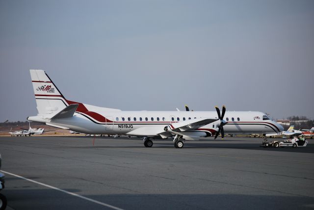 Saab 2000 (N519JG) - Being towed out of the hangar and prepped for departure to Daytona at Concrod Regional Airport (Concord, NC) - 2/10/09