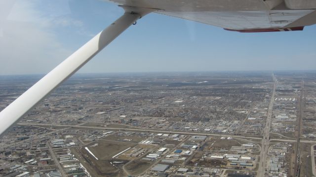 Cessna Skyhawk (N7526T) - Flying over Fargo, ND.