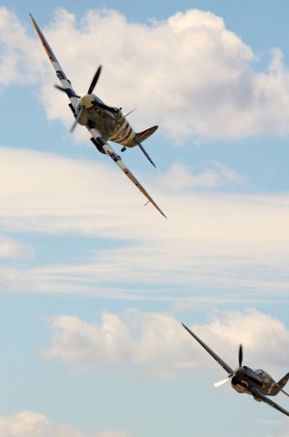 SUPERMARINE Spitfire (N959RT) - Approaching the first pylon, N959RT / MK959, "Normandy Split," a Supermarine Spitfire MKIX piloted by Warren Pietsch, leads (but not by much) a P-40E Kittyhawk, "Texas Warhawk," (N2416X, originally 41-5709) piloted by Bernie Vasquez, in a Thursday afternoon Unlimited Class race at the 2017 National Championship Air Races / Reno Air Races.  Both aircraft are owned by the Texas Flying Legends Museum.