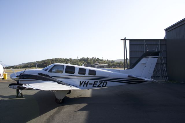 Beechcraft Baron (58) (VH-EZD) - VH-EZD, Beechcraft Baron parked at Hamilton Island Airport