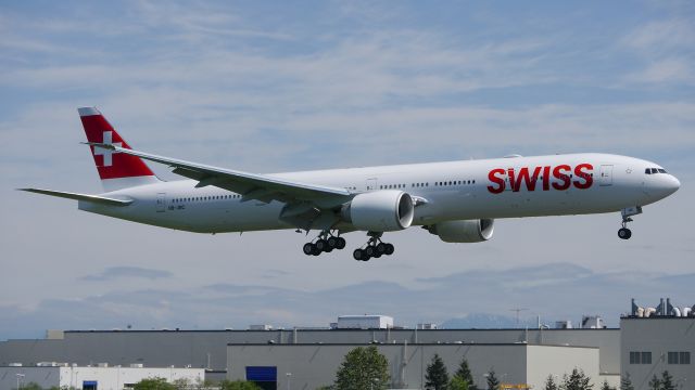 BOEING 777-300 (HB-JNC) - BOE578 on final to Rwy 16R to complete a C1 flight on 4/21/16. (ln 1391 / cn 44584).