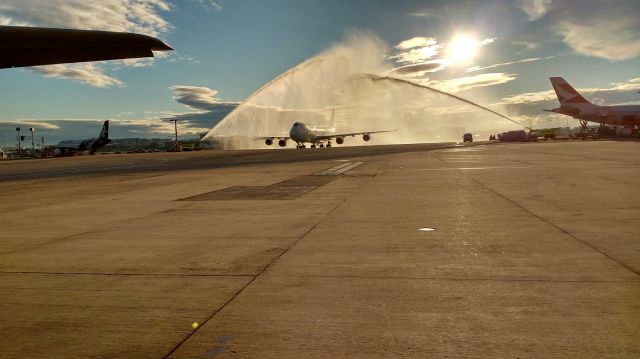 Boeing 747-200 (VH-OQK) - Return of the paraolympians , shower courtesy of the Airport Rescue Services 