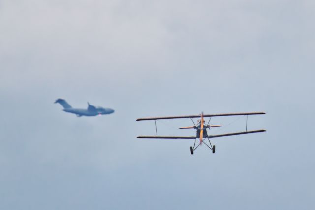 VH-FLF — - As it happened.  A Fleet 2 biplane with a C17 Globemaster passing behind.