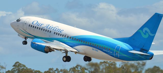 BOEING 737-300 (VH-INU) - Our Airline leaving Runway 28 at Gladstone, Queensland. January 2014