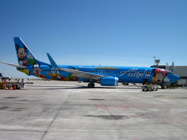 Boeing 737-700 (N318AS) - Parked at the gate on A concourse at DIA.