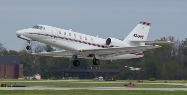 Cessna Citation Sovereign (N315QS) - Taken about four months ago (in October, 2014).  While visting the US Air Force Museum in Ohio, stopped at the Ohio State University airport in Columbus to check it out and caught this Cessna 680 taking off from runway 27L. There are already several pics of this one in the FA gallery but none show it in the air so I figured it would be neat to post this airborne snap of it. 