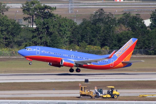 BOEING 737-300 (N602SW) - Southwest Airlines (WN) N602SW B737-3H4 [cn27953]  Orlando (MCO)br /Southwest Airlines flight WN1255 departing to San Antonio (SAT).br /Taken from MCO Terminal Top Parking Garagebr /2017 05 15  a rel=nofollow href=http://alphayankee.smugmug.comhttps://alphayankee.smugmug.com/a