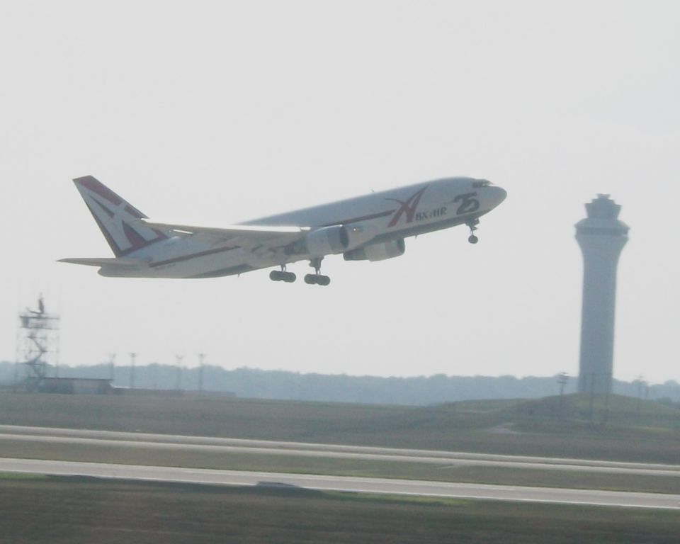 BOEING 767-200 (N792AX) - Abex 601 Heavy lifts off with a very early rotation off 36R sporting the 25 Years of Airborne Express.    Taken: 8/22/2010