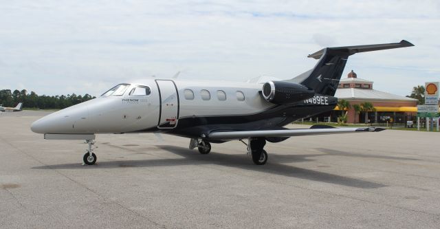 Embraer Phenom 100 (N489EE) - An Embraer EMB-500 Phenom 100E on the Gulf Air Center ramp at Jack Edwards National Airport, Gulf Shores, AL - June 28, 2017. Thanks to Felipe Alfaia of Embraer Executive Jets for giving me permission to post the photo. This is a two-tone silver /gray, navy blue fuselage and I just did not do the color scheme justice with the camera setting I used.  