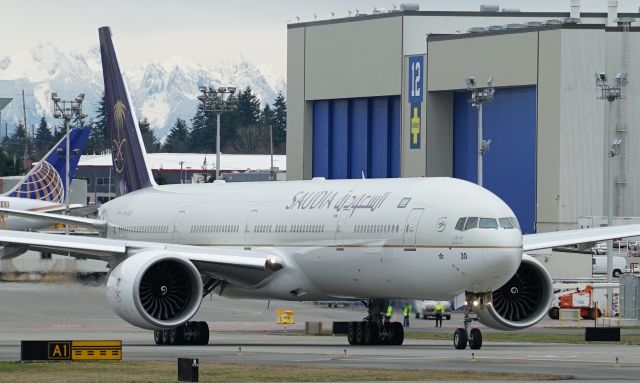 BOEING 777-300ER (HZ-AK30) - The newest 777 for Saudia, HZ-AK30, holding short of Runway 16R at Paine Field yesterday as the third and final departure in Saudias massive triple delivery to Jeddah on February 3rd. 