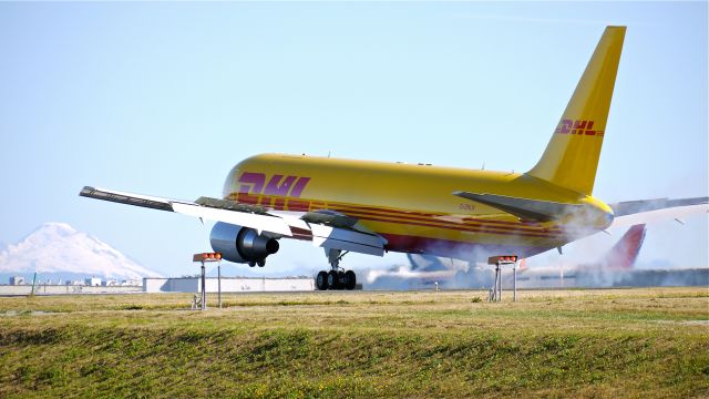 BOEING 767-300 (G-DHLH) - BOE544 touching down on runway 34L to complete a flight test on 9/7/12. (LN:1036  c/n 37808).