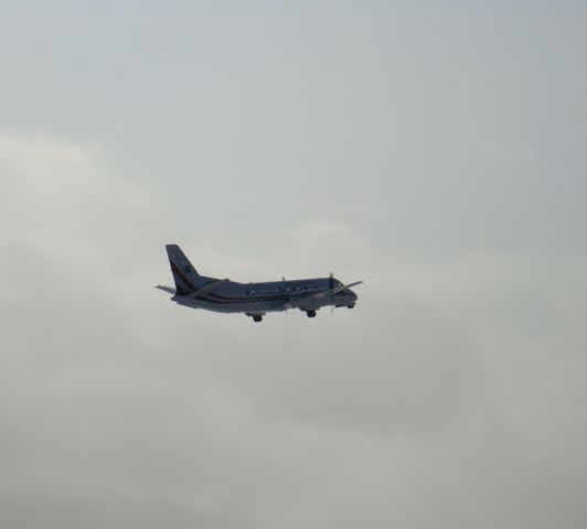 Saab 340 (C-GXPS) - Climbing out on a snowy day