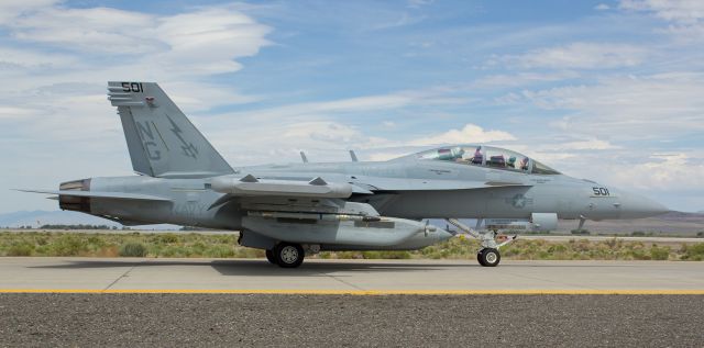 16-8263 — - The pilot of this EA-18G gives a "Thumbs Up" to our group of photographers as he taxies his VAQ-133 "Wizards" Growler down NAS Fallons taxiway Alpha for takeoff on runway 31L.  168263 is the second of three Growlers I caught at NFL during the afternoon. 