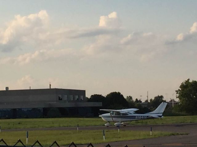 Cessna Skylane (N1841X) - Standing right outside the fencing around airport.