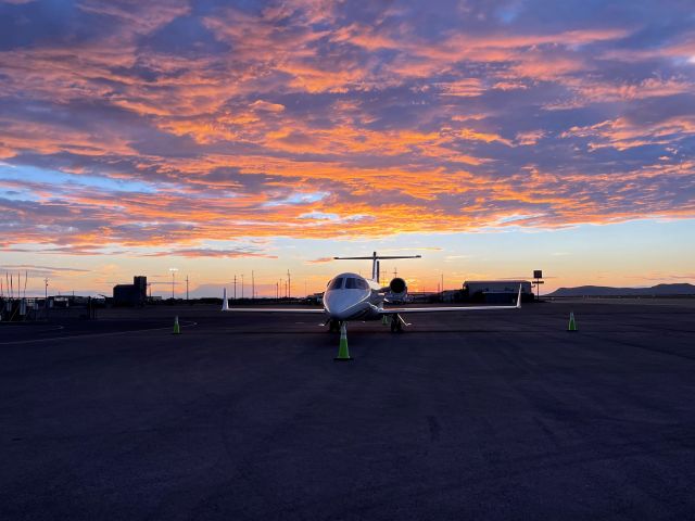 — — - Lear 45 during sunset.