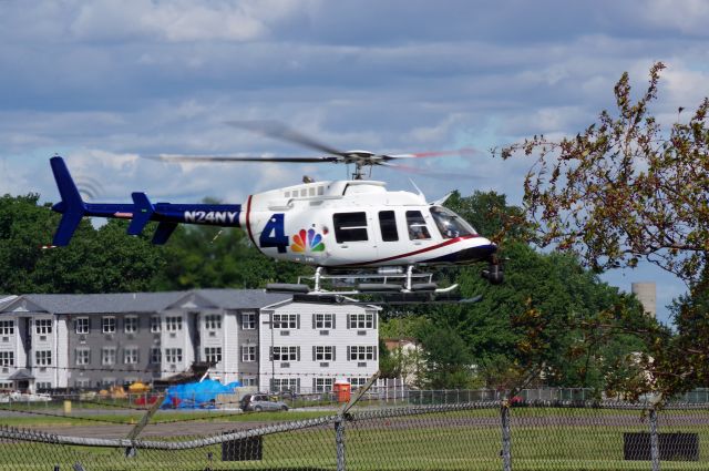 Bell 407 (N24NY) - LINDEN AIRPORT-LINDEN. NEW JERSEY, USA-SEPTEMBER 03, 2021: Seen preparing to land and re-fuel at Linden Airport is a helicopter from one of the local T.V. stations in New York City.