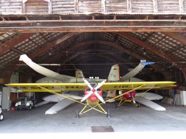 Piper L-21 Super Cub (HB-ORT) - Piper Cub inside the old hangar at Bex used for glider towing. I love the hangars beautiful wooden beams roof structure. This is the original hangar built in 1924 when the Aerodrome was born.