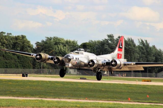 Boeing B-17 Flying Fortress (N3193G) - Left main wheel 1st on Runway 36 Oshkosh.  