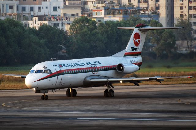 Fokker Fellowship (S2-ACW) - 17th February 2012:  Taxiing on November for departure from runway 14 at Dhaka's Zia International Airport.