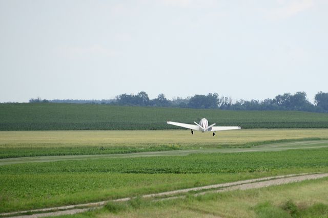 Beechcraft 35 Bonanza (N5316E) - Crosswind takeoff at the family farm near Sutton, ND