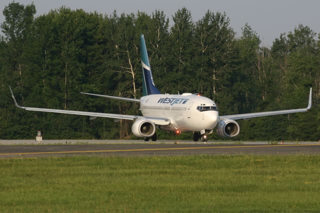 Boeing 737-700 (C-FWAQ) - July 1, 2006 - morning departure from London 