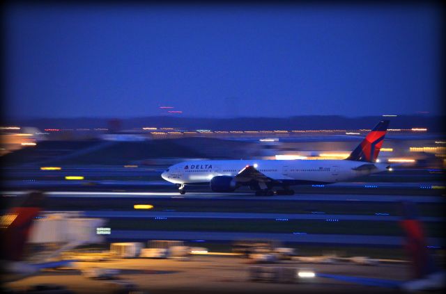 Boeing 777-200 (N702DN) - Taken from the roof of A Concourse during the night shift