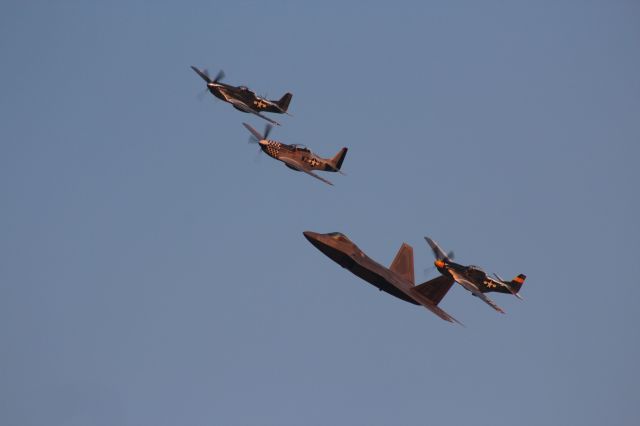 Lockheed F-22 Raptor — - The setting sun strikes the USAF Heritage Flight at Oshkosh 2019.  