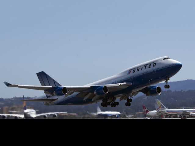 Boeing 747-400 (N180UA) - Big iron on the San Francisco international airport. An Airbus A380 in the background left.