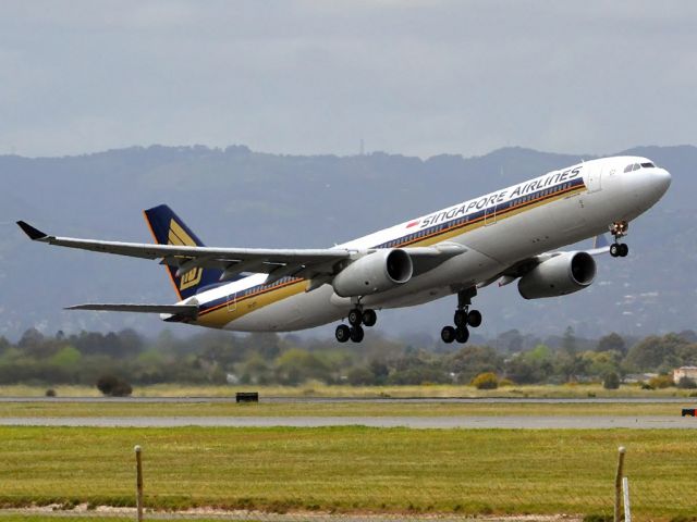 Airbus A330-300 (9V-STI) - Getting airborne off runway 23 and heading home to Singapore. Friday 5th October 2012.