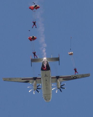 — — - Red Devils parachute team jumping from a Navy C-2A Greyhound over NAS Oceana