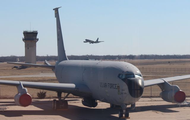 Boeing C-135FR Stratotanker — - 022314 USAF KC135R rotating from Rwy 1L over KC135E at the Kansas Aviation Museum