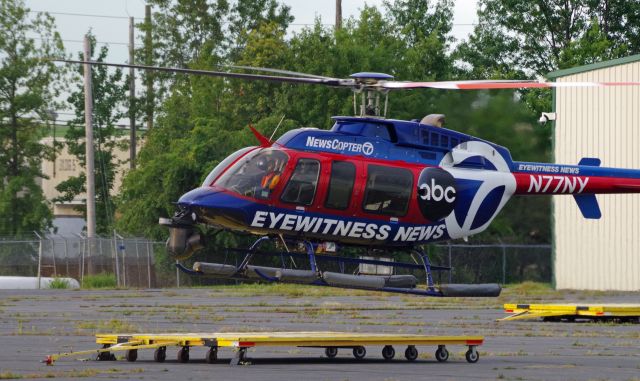 Bell 407 (N77NY) - LINDEN AIRPORT-LINDEN, NEW JERSEY, USA-AUGUST 31, 2020: A news helicopter from one of the local New York City television stations is seen preparing to land after completing its first flight of the morning.