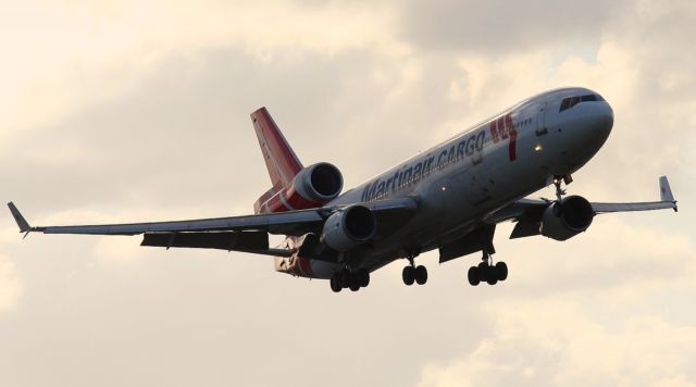 Boeing MD-11 (PH-MCT) - On short final to 9. Taken from El Dorado. 4/15/12