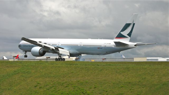 BOEING 777-300 (B-KQB) - BOE239 (LN:1012) touching down on runway 34L on 4/26/12. The aircraft was returning from KPDX where it was painted.