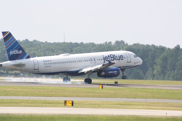 Airbus A320 (N593JB) - N593JB touching down runway 23L