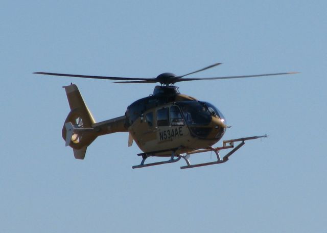 Eurocopter EC-635 (N534AE) - Hovering over the Downtown Shreveport Airport. The aircraft has experimental above the registration. They must be testing the boom or probe that is attached to the skid.