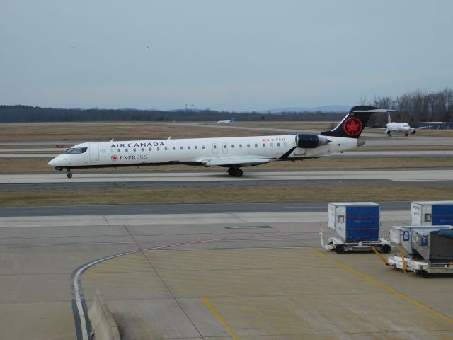 Canadair Regional Jet CRJ-900 (C-FOJZ) - Air Canada Express (Jazz) CRJ-900 taxiing to the gate at Washington Dulles International Airport