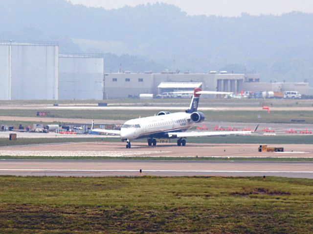 Canadair Regional Jet CRJ-700 (N718PS) - Holding Short of 20C on 5/19/2013