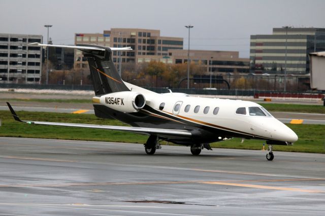 Embraer Phenom 300 (N354FX) - Taxiing out to 30L for departure.  01-05-2016