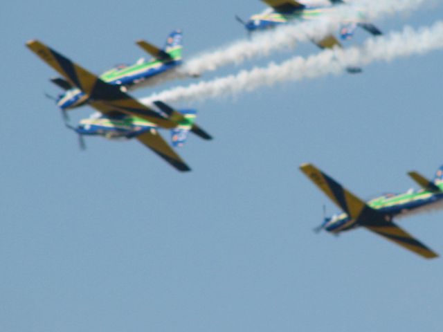 — — - Brazilian AF Aerobatic team Fumaca flying close formation in Tucanos